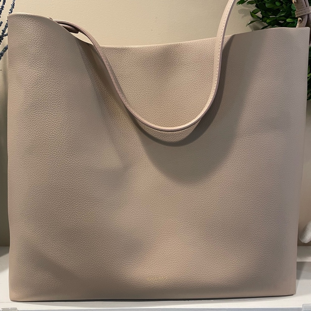 Mina Baie brand tan vegan bag/diaper bag. Unused.  Comes with multiple handles.